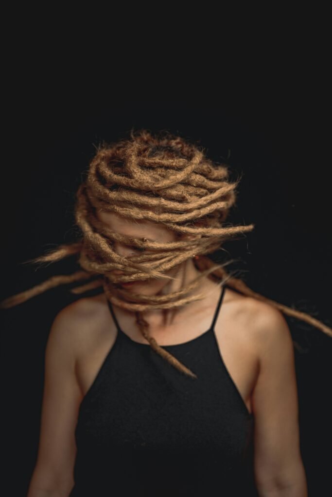 Woman with long Rastas. Image Credit: Alonso Reyes | Unsplash | Unsplash