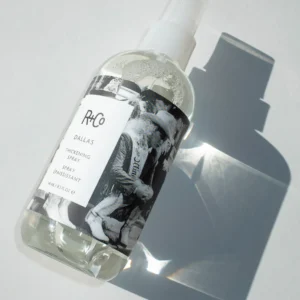 "Bottle of R+Co Dallas Thickening Spray – lightweight volumizing mist for fine, straight hair enriched with Biotin and Vitamin B5