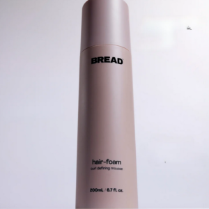 Alcohol-free volumizing foam for curly and textured hair, providing frizz control and bounce while defining curls and enhancing volume.