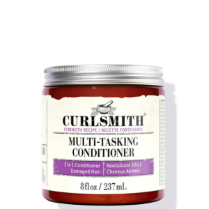 Bottle of Curlsmith Multi-Tasking Conditioner – protein-moisture balanced formula with pea protein and resurrection flower for adaptable hair care.