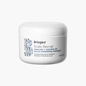 Jar of Briogeo Scalp Revival Shampoo with charcoal and coconut oil, designed for scalp exfoliation and itch relief.